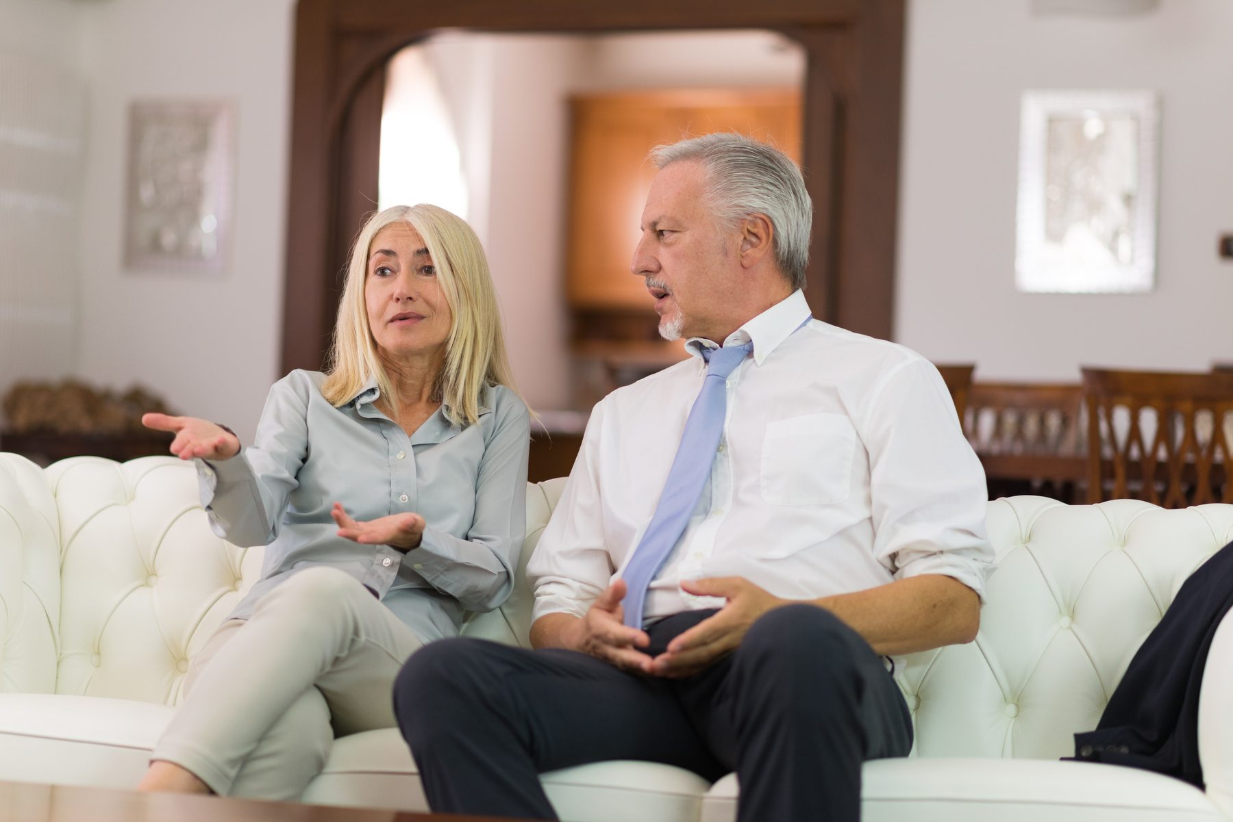 A couple in conversation at home